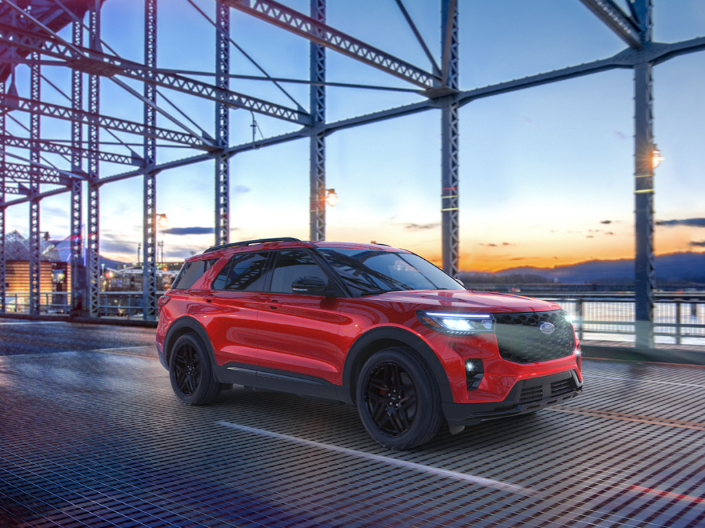 The new Ford Explorer drives across a bridge, showcasing its style and prowess. Shop for your new Ford Explorer at Cleveland Ford today.